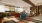 a clubhouse room with chairs, tables, couches and a window