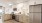 a kitchen with white and wooden cabinets